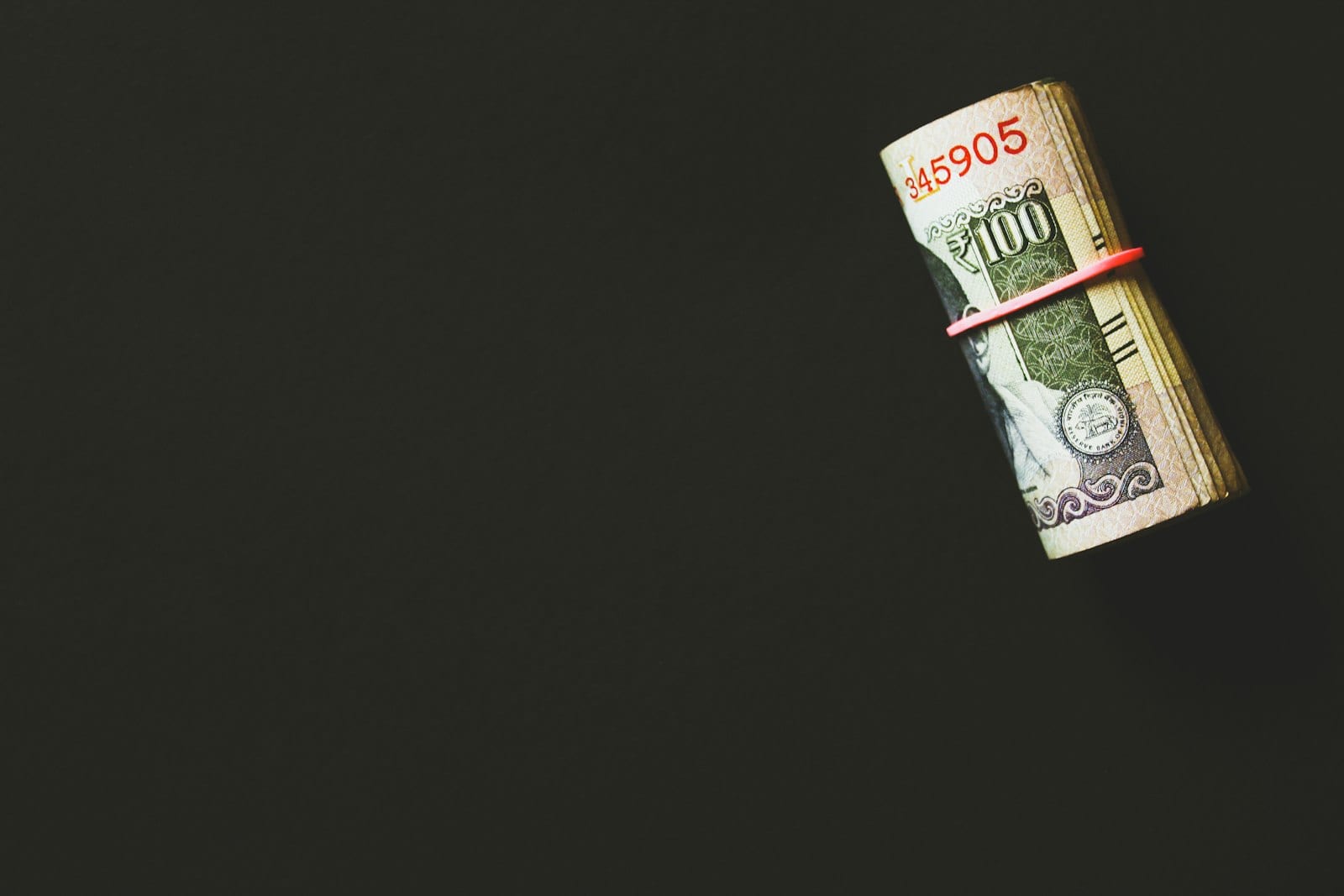 Smartphone displaying a free budgeting app held in hand