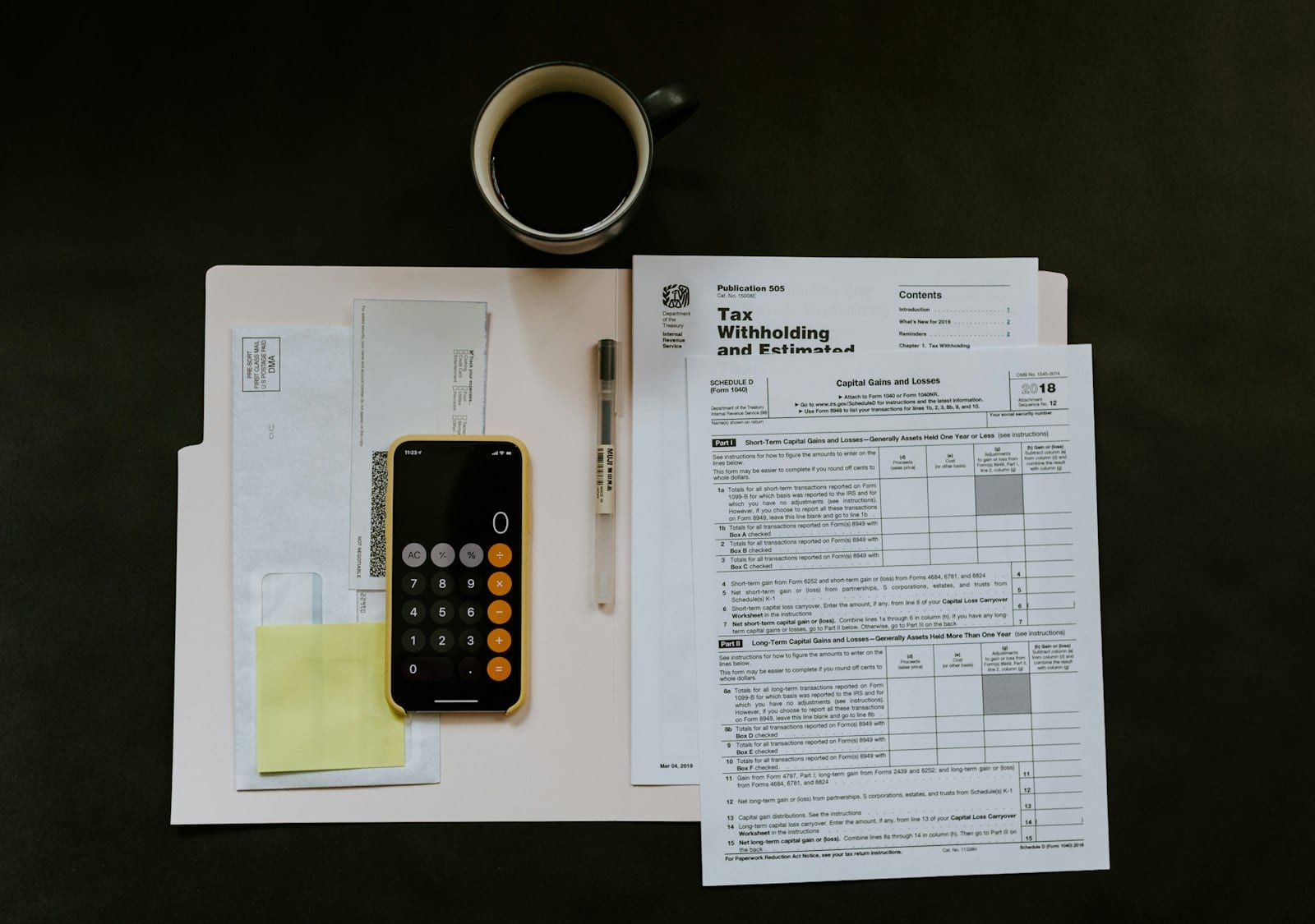 Cash tucked into envelopes using the envelope budgeting method