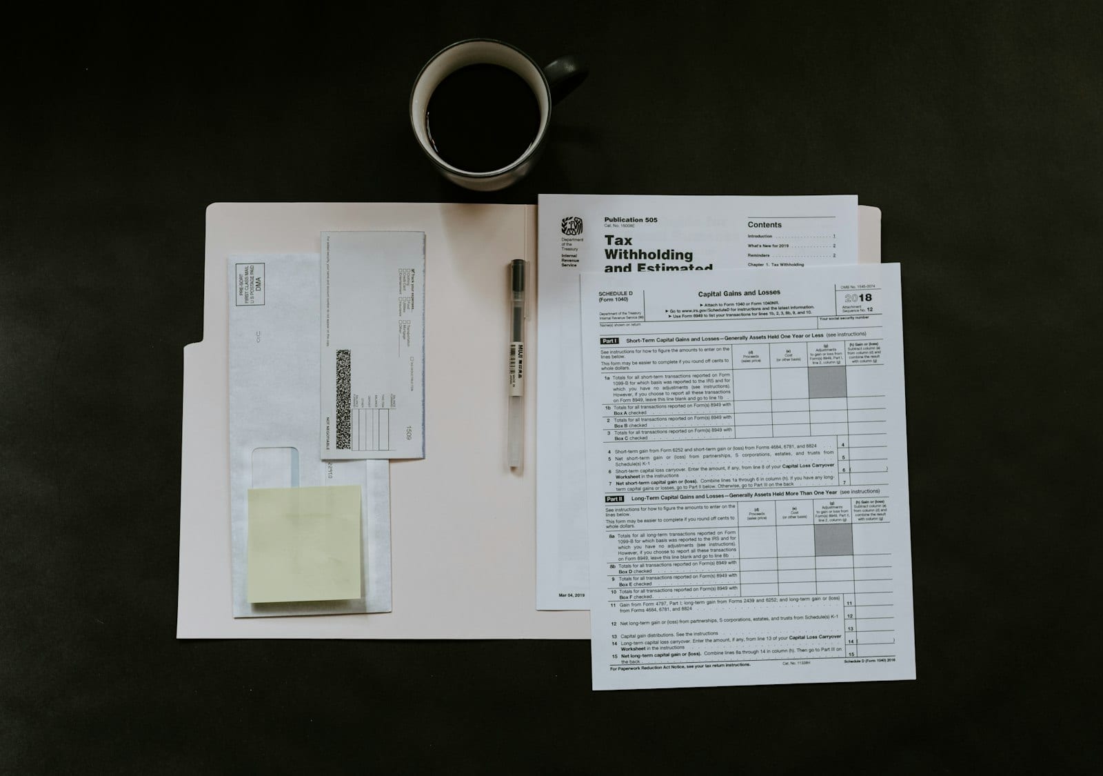 Person reviewing a credit report and notes for credit repair
